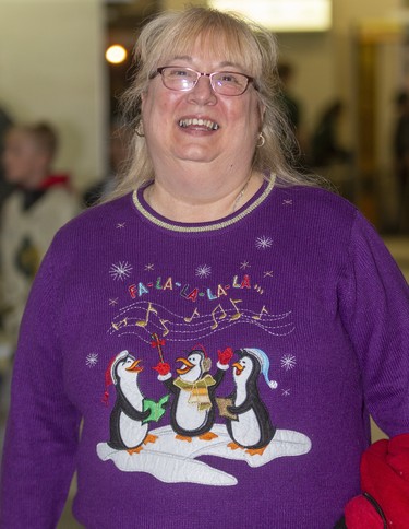 Diana Bennett enjoys the atmosphere at Ugly Sweater Night at the London Knights game against the Sarnia Sting at Budweiser Gardens in London on Friday. (Mike Hensen/The London Free Press)