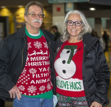 Al Viger and Barb Gambacort take part in Ugly Sweater Night at the London Knights game against the Sarnia Sting at Budweiser Gardens in London on Friday. (Mike Hensen/The London Free Press)