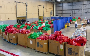 Backstage at the Salvation Army's Christmas hamper giveaway at the Western Fair Agriplex  shows red and green gift bags for boys and girls with various age groups separated.  Photograph taken on Monday December 16, 2019.  Mike Hensen/The London Free Press/Postmedia Networkn London, Ont.  Photograph taken on Monday December 16, 2019.  Mike Hensen/The London Free Press/Postmedia Network
