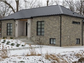 This house at 203 Commissioners Rd. E. was raided by police on Thursday as part of a series of raids on homes connected with the Hells Angels. (Mike Hensen/The London Free Press)