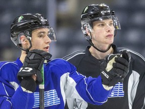 The London Knights' Russian contingent are back as Matvey Guskov chats with returning Kirill Styeklov at their early practice Wednesday before the team boarded the bus for North Bay.  (Mike Hensen/The London Free Press)