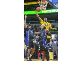 Marcus Capers of the Lightning goes up for the first two points of the Lightning's season during their home opener game against the Kitchener-Waterloo Titans at Budweiser Gardens in London, Ont. on Friday Dec. 27, 2019.  (Mike Hensen/The London Free Press)