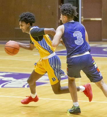 Beal's Yoal Tsehaye breaks for the hoop around St. Joseph's Liam Gilbert during their consolation semi-final that they won 67-48 Sunday at Alumni Hall.
They were playing in the 62nd annual Purple and White basketball tournament in London. Photograph taken on Sunday December 29, 2019. 
Mike Hensen/The London Free Press/Postmedia Network