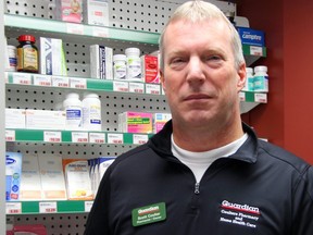 Scott Coulter, owner of Coulter Pharmacy in London, holds a naloxone kit used to temporarily reverse the effects of an opioid overdose. Provincial figures show Southwestern Ontario pharmacies 
distributed more than 47,000 kits from July 2016 to April 2019.  Jennifer Bieman/The London Free Press/Postmedia Network