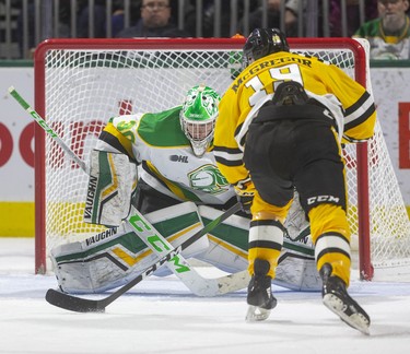 Knights goalie Brett Brochu closes it down as Sarnia's Ryan McGregor gets in alone during their New Year's Eve game Tuesday afternoon at Budweiser Gardens in London. Mike Hensen/The London Free Press/Postmedia Network