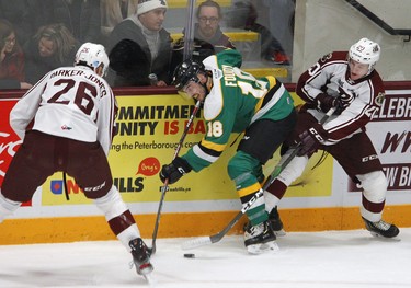 Peterborough Petes' John Parker-Jones and teammate Declan Chisholm pressure London Knights' Liam Foudy during first period OHL action on Thursday December 5, 2019 at the Memorial Centre in Peterborough, Ont.