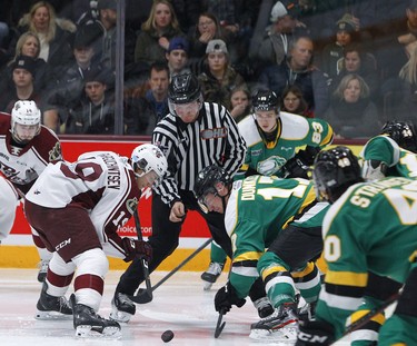 Peterborough Petes' Semyon Der-Arguchintsev faces off against London Knights' Nathan Dunkley during second period OHL action on Thursday December 5, 2019 at the Memorial Centre in Peterborough, Ont.