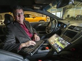 Grant Courville, vice-president of product management and strategy at Blackberry's QNX subsidiary, works with a completely autonomous test vehicle using all the engineering features they employ to  develop their software products. (Wayne Cuddington, Postmedia Network)