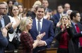 Leader of the Opposition Andrew Scheer is applauded by caucus members as he announces he will step down as leader of the Conservatives, Thursday, December 12, 2019 in the House of Commons in Ottawa. THE CANADIAN PRESS/Adrian Wyld