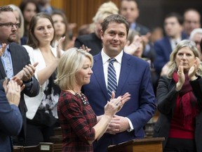 Leader of the Opposition Andrew Scheer is applauded by caucus members as he announces he will step down as leader of the Conservatives, Thursday, December 12, 2019 in the House of Commons in Ottawa. THE CANADIAN PRESS/Adrian Wyld