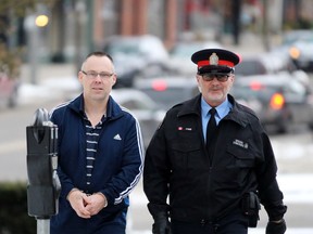 David Sullivan, left, is escorted into the Perth County Courthouse by Patrick Kelly, a Stratford police special constable, on Tuesday December 17, 2019 in Stratford, Ont. (Terry Bridge/Stratford Beacon Herald)