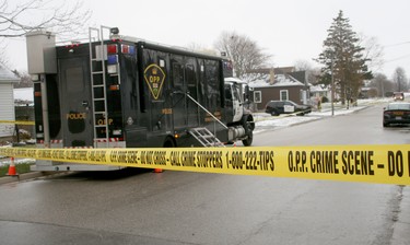 The province's Special Investigations Unit is on scene at Exeter's Simcoe Street after a fatal shooting last night. Simcoe between Andrew and Albert streets remains cordoned off by police. Forty-four-year-old Wade Vanderwal is dead after a confrontation with police during which the SIU says Vanderwal came at OPP with an axe. (Scott Nixon, Postmedia Network)