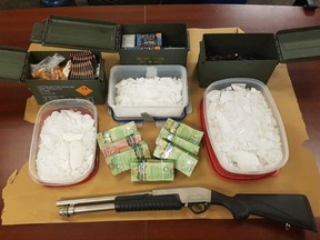 Two men are charged after London police seized 4.6 kilograms of crystal methamphetamine, worth $462,400, a shotgun, ammunition and about $60,000 in cash after searching two locations in the city Thursday. (Contributed/London Police Service)