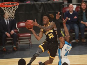 The London Lightning's Anthony Gaines Jr. drives to hoop for two against the Halifax Hurricanes' Antoine Mason, duringNational Basketball League of Canada action in Halifax on Tuesday. The Lightning won 112-101. (Tim Krochak/ The Chronicle Herald)