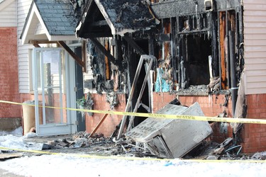 A fire at 99 Kimberley Ave. damaged three townhouses on Tuesday night. A London man, 28, is charged with arson with disregard for human life. (DALE CARRUTHERS, The London Free Press)