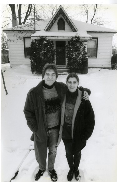 gaeten and Jill LaBell stand in front of their Colborne Street cottage that was demolished to make room for condominiums, 1989. (London Free Press files)