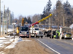 Investigators and cleanup crews were still on scene about noon Tuesday after a dump truck carrying road salt rolled over on Highway 7/8 southwest of Shakespeare about 7:30 a.m. The crash closed the highway between Perth roads 109 and 110. (Galen Simmons/Postmedia News)