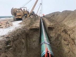 Trans Mountain construction is underway with in several Alberta - Trans Mountain tweeted this photo of pipe in the ground near Edmonton.  Trans Mountain Marks the Start of Pipeline Construction ConstructionÕs underway in #Alberta, including pipe transport, stringing & assembling in Greater #Edmonton, right-of-way preparation in Yellowhead, and work at our Edmonton Terminal & two pump stations.