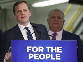 Jeff Yurek, shown in this photo with Premier Doug Ford, announced Friday he won't run in the June provincial election and will step down as MPP for Elgin-Middlesex-London in February. (Postmedia News file photo)