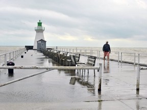 Record-high water levels in the Great Lakes are not only threatening the iconic lighthouse in Port Dover, shown in this August 2019 photo, and other shoreline structures, they also increase the threat that contaminants deposited in previous decades may be shaken loose from sediments. (Postmedia file photo)