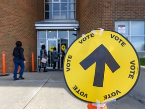 People enter a polling station in Calgary to vote in the federal election in October 2019. (Postmedia file photo)