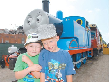 Scott Patterson and Caleb Matson stand in front of their favourite train, Thomas the Tank Engine, during Day Out With Thomas and Friends at the St. Thomas-Elgin Memorial Centre. (Postmedia Network file photo)