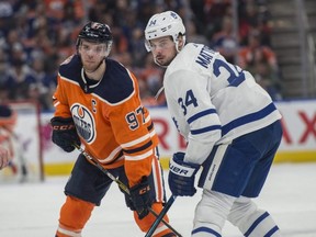 Connor McDavid (97) of the Edmonton Oilers faces off with Auston Matthews (34) of the Toronto Maple Leafs at Rogers Place in Edmonton on March 9, 2018. (Shaughn Butts/Postmedia Network)