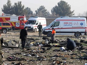 Rescuers work amid debris after a Ukrainian plane carrying 176 passengers and crew crashed near Imam Khomeini airport in  Iran's capital, Tehran, early Wednesday, killing all aboard. (AFP via Getty Images)