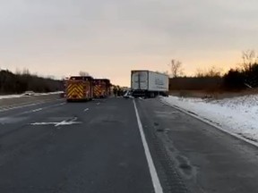 Emergency crews at the scene of a fatal collision on Highway 401 east of Mill Street in Newcastle on Tuesday.
