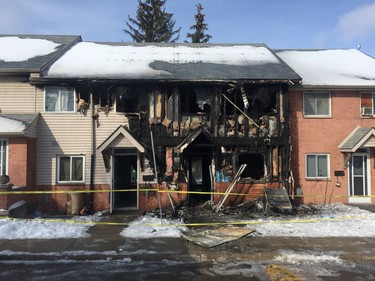 A man is charged with arson with disregard for human life following a Tuesday night fire at a Kimberly Avenue townhouse complex. (DALE CARRUTHERS, The London Free Press)
