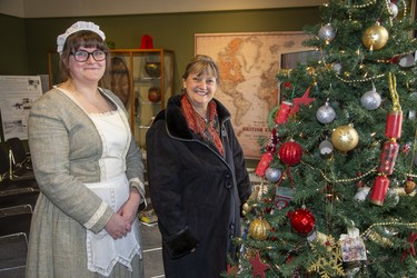 Interim program co-ordinator Brenna Ardiel (dressed as a Victorian servant) poses with visitor Kathy Kozell during the Eldon House's annual New Year's Day levee in London, Ont. on Wednesday January 1, 2020. The levee is one of the best attended days of the year at the historic home built in 1834. The day was also kicked off a fund raising campaign for a new kitchen. A goal of $65,000 has been set to build a kitchen in the coach house that will be better able to service their catering needs. Derek Ruttan/The London Free Press/Postmedia Network