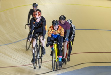 A group of cyclists enjoys a morning ride at the Forest City Velodrome in London on Sunday. Derek Ruttan/The London Free Press/Postmedia Network