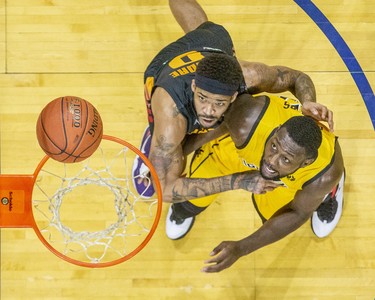 Sudbury Five player Josiah Moore (left) and  London Lightning's Randy Phillips jockey for position to grab a rebound during their basketball game at the Budweiser Gardens in London, Ont. on Sunday January 5, 2020. Derek Ruttan/The London Free Press/Postmedia Network