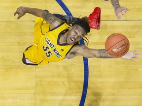 The London Lightning's A.J. Gaines reaches for a rebound during their basketball game against the Sudbury Five at Budweiser Gardens in London on Sunday January 5, 2020. Derek Ruttan/The London Free Press/Postmedia Network