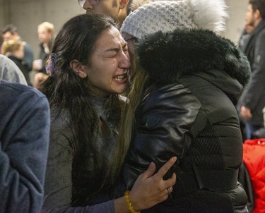 People mourn at a memorial  service at Western University in London, Ont. on Wednesday Jan. 8, 2020 for four Western students killed in the crash of Ukraine International Airline flight PS752 in Iran. Derek Ruttan/The London Free Press
