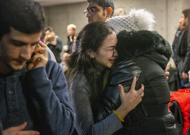 People mourn at a memorial  service at Western University in London, Ont. on Wednesday Jan. 8, 2020 for four Western students killed in the crash of Ukraine International Airline flight PS752 in Iran. Derek Ruttan/The London Free Press