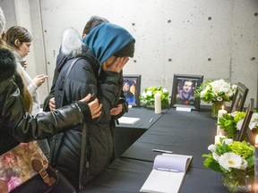 People mourn at a memorial service at Western University in London on Jan. 8 for four Western students killed in the crash of Ukraine International Airline flight PS752 in Iran. (Derek Ruttan/The London Free Press)
