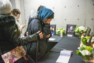 People mourn at a memorial service at Western University in London on Wednesday for four Western students killed in the crash of Ukraine International Airline flight PS752 in Iran. (Derek Ruttan/The London Free Press)