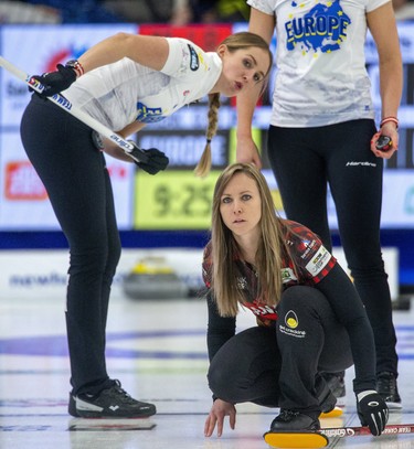 Team Europe's Melanie Barbezat contorts to get a view of a rock thrown by Team Canada's skip Rachel Homan during the opening round of the Continental Cup at the Western Fair Sports Centre in London, Ont. on Thursday January 9, 2020. Homan's team won the contest 6-5. Derek Ruttan/The London Free Press/Postmedia Network