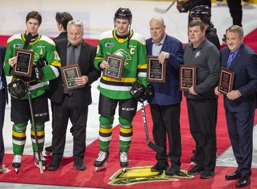 The London Knights presented Team Canada members with plaques in recognition of their gold medal at the World Junior Tournament prior to their game against the Barrie Colts in London, Ont. on Friday January 10, 2020. L TO R Connor McMichael, Dale Hunter (coach), Liam Foudy, Mark Hunter (GM), Chris Maton (equipment manager), and Bob Martin (head of security). Derek Ruttan/The London Free Press/Postmedia Network