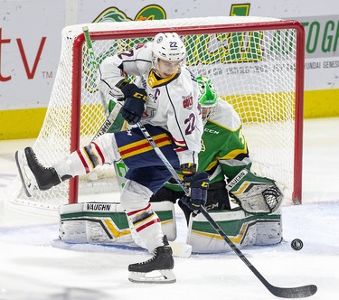 Barrie Colts captain Luke Bignell makes a twisting tip in front of London Knights goalie Brett Brochu during their game at Budweiser Gardens in London, Ont. on Saturday January 11, 2020. Derek Ruttan/The London Free Press/Postmedia Network