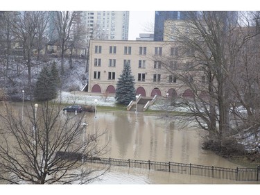 The Thames River spilled its banks, flooding Harris Park in London, after record amounts of rain fell over the weekend. Water remained high on Monday. (Derek Ruttan/The London Free Press)