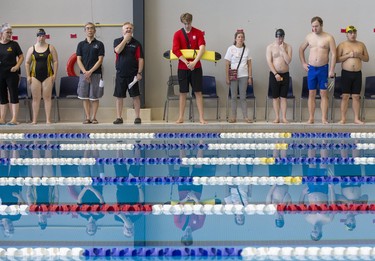 Officials and competitors stand for the national anthem prior to the beginning of the  3rd Annual London Gliders Swim Meet. 180 swimmers from 12 clubs across Southwestern Ontario competed in the Special Olympics meet at the Aquatic Centre in London on Sunday January 19, 2020.  Derek Ruttan/The London Free Press/Postmedia Network