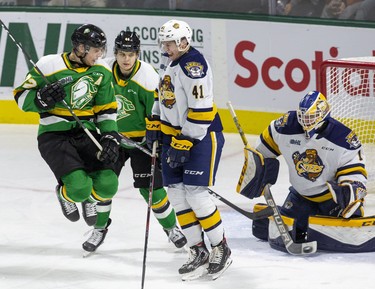 Erie Otter goalie Daniel Murphy makes the save behind London Knights Alec Regula (left) Jonathan Gruden and Otter Kurtis Henry during the third period of their game at Budweiser Gardens in London, Ont. on Sunday January 19, 2020. Derek Ruttan/The London Free Press/Postmedia Network