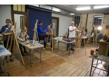 Oil painting students stroke their canvasses during a class taught by artist Paul Abeleira at the TAP Centre For Creativity in London on Thursday January 23, 2020. To take part in one of the many different art classes offered by TAP check out their website www.tapcreativity.org. Left TO right are Kirsten Von Holtzendorff, Jan Collins, Paul Abeleira, David Bratton, Martin Wall, Wendy Hill and Deb Pullen. (Derek Ruttan/The London Free Press)