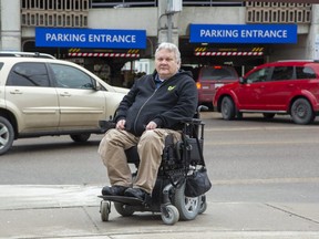 Peter Zein  says the parking setup at  London hospitals (gates, tickets, automated payment machines) are a major barrier for quadriplegics like him. (Derek Ruttan/The London Free Press)