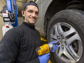 Abdulfatah Almasri, a Syrian refugee settled in London, is getting back to work as a licensed mechanic with his own shop. (Free Press file photo)