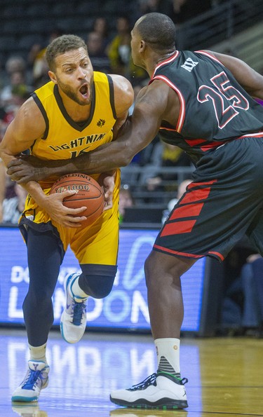 Garrett Williamson of the London Lightning reacts as he's fouled by Windsor's Derrick Nix during the first half of their NBL game Thursday night at Budweiser Gardens in London. (Mike Hensen/The London Free Press/Postmedia Network)