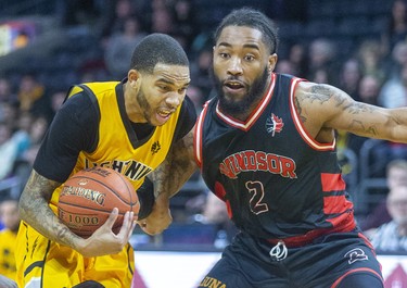 Xavier Moon of the London Lightning uses his speed to beat Windsor's DeShaun Thrower during the first half of their NBL game Thursday night at Budweiser Gardens in London. (Mike Hensen/The London Free Press/Postmedia Network)