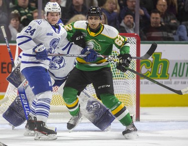 Sahil Panwar of the Knights tries to hold his position in front of Mississauga goalie Kai Edmonds as Liam Ham of the Steelheads tries to move him during the first period of their game Friday night at Budweiser Gardens in London, Ont. 
Photograph taken on Friday January 3, 2020. 
Mike Hensen/The London Free Press/Postmedia Network